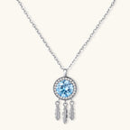 Sterling silver dreamcatcher pendant with blue moissanite center and three feather charms on adjustable chain.