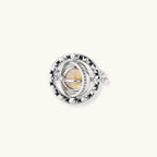 Adjustable brass ring with rotating zirconia center, surrounded by black enamel celestial stars and moon details