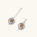 Complete jewelry set featuring citrine stone chips, silver beads, and cosmic circle pendants on cream background.