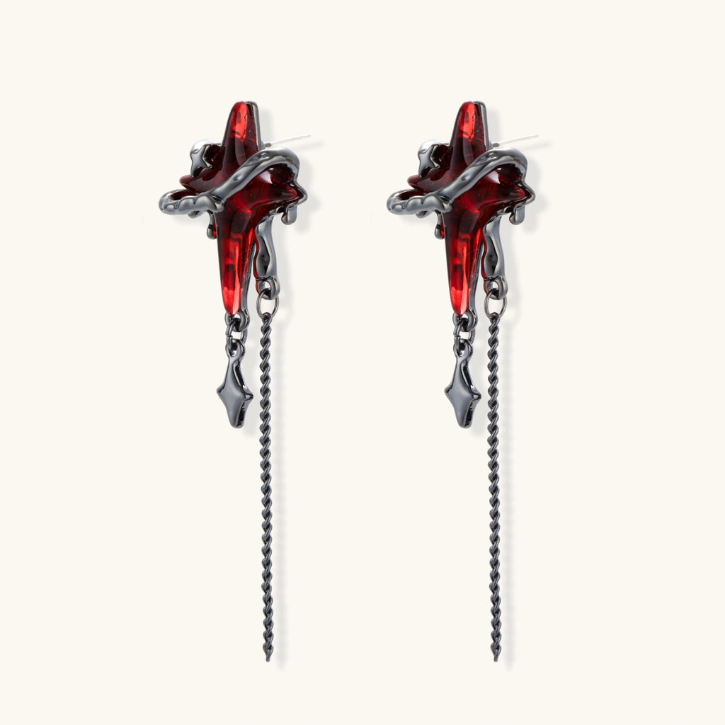 Gothic red resin dagger earrings with silver chain details and S925 posts on white background