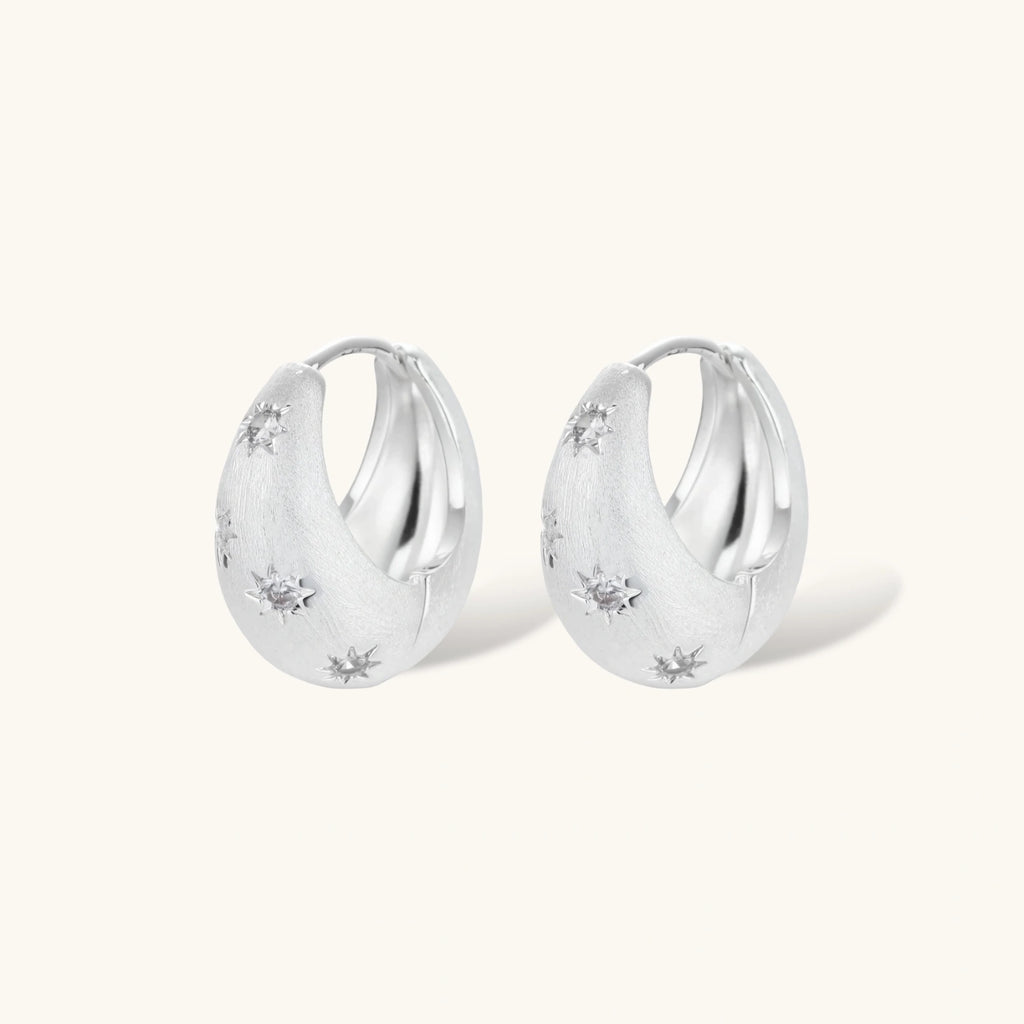 Silver-plated hoop earrings with star cutout designs, shown open and closed on white background, 17mm diameter.