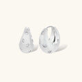 Silver-plated hoop earrings with star cutout designs, shown open and closed on white background, 17mm diameter.